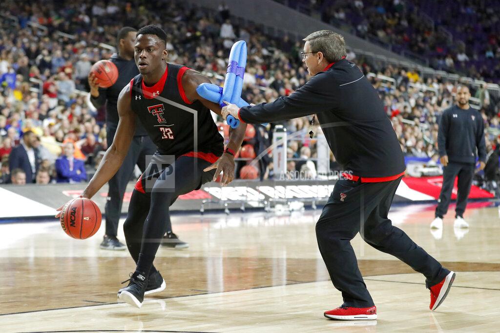 Charlie Neibergall Texas Tech's Norense Odiase (32) warms up during a practice session for the semifinals of the Final Four NCAA college basketball tournament, Friday, April 5, 2019, in Minneapolis. (AP Photo/Charlie Neibergall)