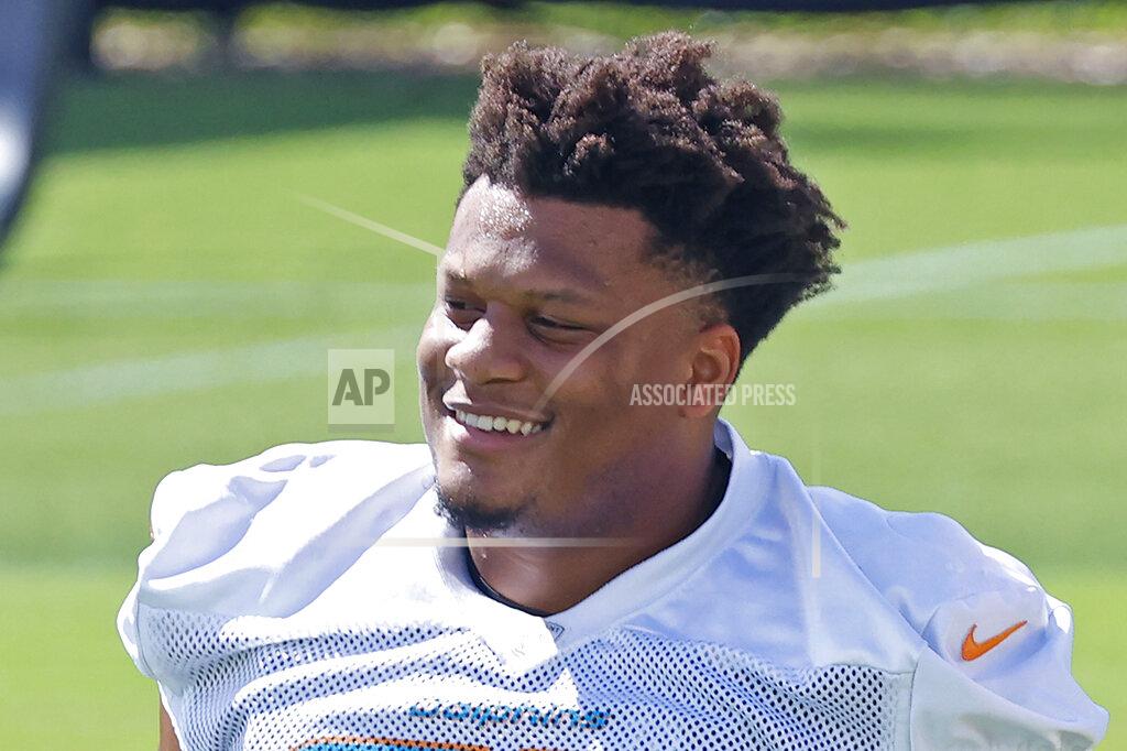 Joel Auerbach FILE - Miami Dolphins' Ereck Flowers looks on between drills during NFL football practice in Davie, Fla., in this Friday, Sept. 11, 2020, file photo. The Miami Dolphins agreed to trade veteran guard Ereck Flowers to Washington in a deal Tuesday, April 27, 2021, that also included a swap of late-round draft picks. The Dolphins will pay Flowers $6 million as a signing bonus for a restructured contract this year, and Washington will pay him a $3 million base salary, said his agent, Drew Rosenhaus. (AP Photo/Joel Auerbach, File)