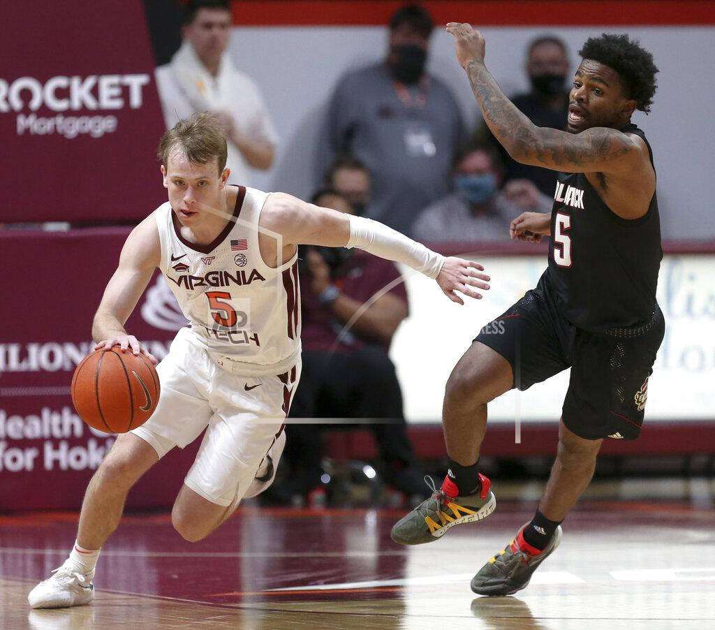 Matt Gentry Virginia Tech's Storm Murphy (5) drives against North Carolina State's Thomas Allen (5) in the first half of an NCAA college basketball game Tuesday, Jan. 4, 2022, in Blacksburg, Va. (Matt Gentry/The Roanoke Times via AP)