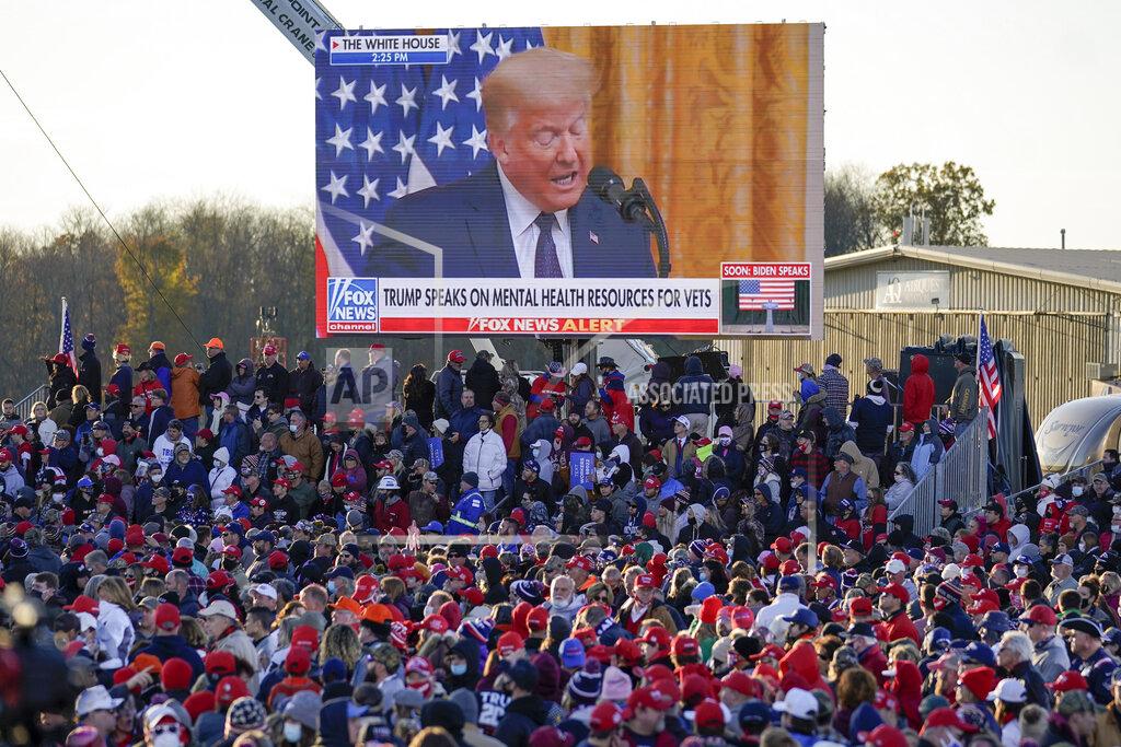 Keith Srakocic A throng of supporters listen to a video message as they await President Donald Trump for a campaign stop, Saturday, Oct. 31, 2020, at the Butler County Regional Airport in Butler, Pa. (AP Photo/Keith Srakocic)
