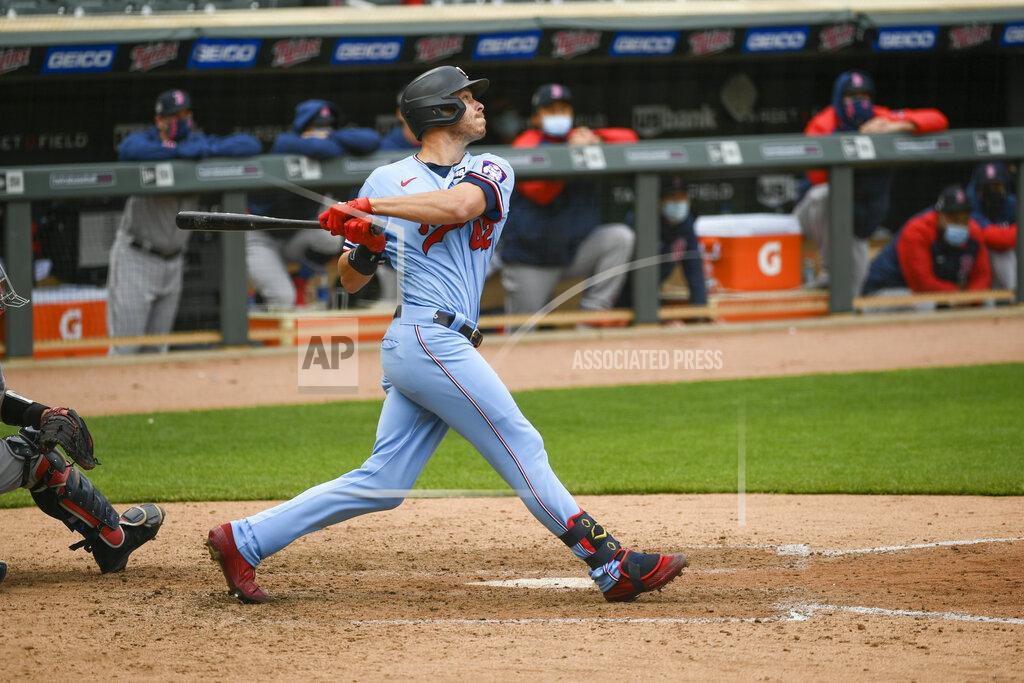 Craig Lassig Minnesota Twins Max Kepler hits a single to center field to drive in the winning run during the ninth inning of a baseball game against the Boston Red Sox, Thursday, April 15, 2021, in Minneapolis. The Twins won 4-3. (AP Photo/Craig Lassig)