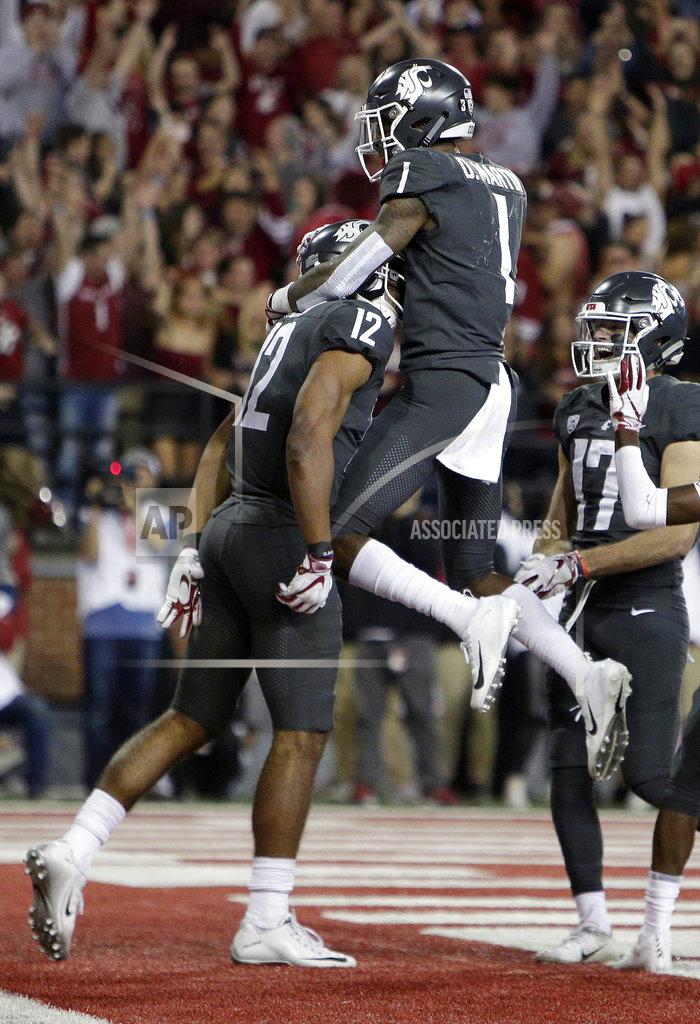 Young Kwak Washington State wide receiver Dezmon Patmon (12) celebrates his touchdown catch with teammate wide receiver Davontavean Martin (1) during the second half of an NCAA college football game against Oregon in Pullman, Wash., Saturday, Oct. 20, 2018. Washington State won 34-20. (AP Photo/Young Kwak)