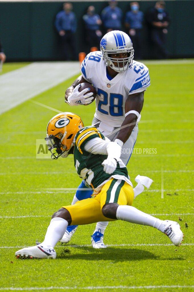 Mike Roemer Detroit Lions' Adrian Peterson runs during the first half of an NFL football game against the Green Bay Packers Sunday, Sept. 20, 2020, in Green Bay, Wis. (AP Photo/Mike Roemer)