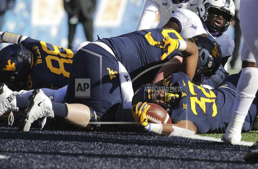 Ray Thompson West Virginia running back Martell Pettaway (32) crosses the goal line for a touchdown during the first half of an NCAA college football game against TCU, Saturday, Nov. 10, 2018, in Morgantown, W.Va. (AP Photo/Raymond Thompson)