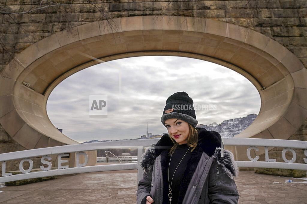 Keith Srakocic In this Monday, Feb. 8, 2021, photo, Allissa Star poses for a photograph along the north shore of the Allegheny River in Pittsburgh. Starr worked about a week every month at a brothel in Pahrump, Nev., outside of Las Vegas. Then the pandemic led to the shuttering of Nevada's licensed bordellos, the only place where prostitution is legal in the state, and they have remained closed since March, leaving sex workers like Starr struggling to pay the bills and turning to alternatives like "virtual" dates. (AP Photo/Keith Srakocic)