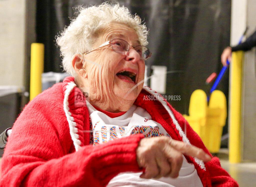 Nati Harnik 98-year-old Florence Dalby demonstrates her ritual every time a Nebraska player shoots a free throw, where she points her right index finger at him, moving it back and forth to telegraph positive vibes, during an interview with the Associated Press before an NCAA college basketball game between Ohio State and Nebraska in Lincoln, Neb., Saturday, Jan. 26, 2019. Dalby is a University of Nebraska Lincoln graduate and has had a men's basketball season ticket for more than 80 years. Dalby loves Nebraska as much today as she did when she first started going to games in 1939. The Cornhuskers honored her during their Coaches Vs. Cancer game against Ohio State. (AP Photo/Nati Harnik)