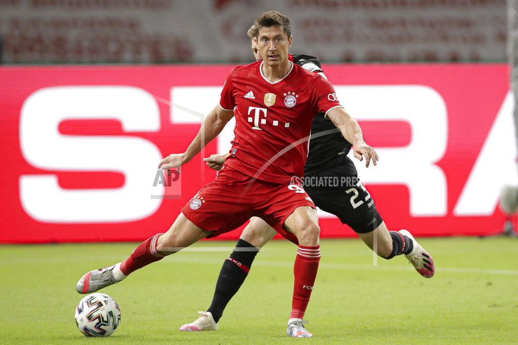Michael Sohn Bayern's Robert Lewandowski challenges for the ball with Leverkusen's Mitchell Weiser during the German soccer cup (DFB Pokal) final match between Bayer 04 Leverkusen and FC Bayern Munich in Berlin, Germany, Saturday, July 4, 2020. (AP Photo/Michael Sohn)
