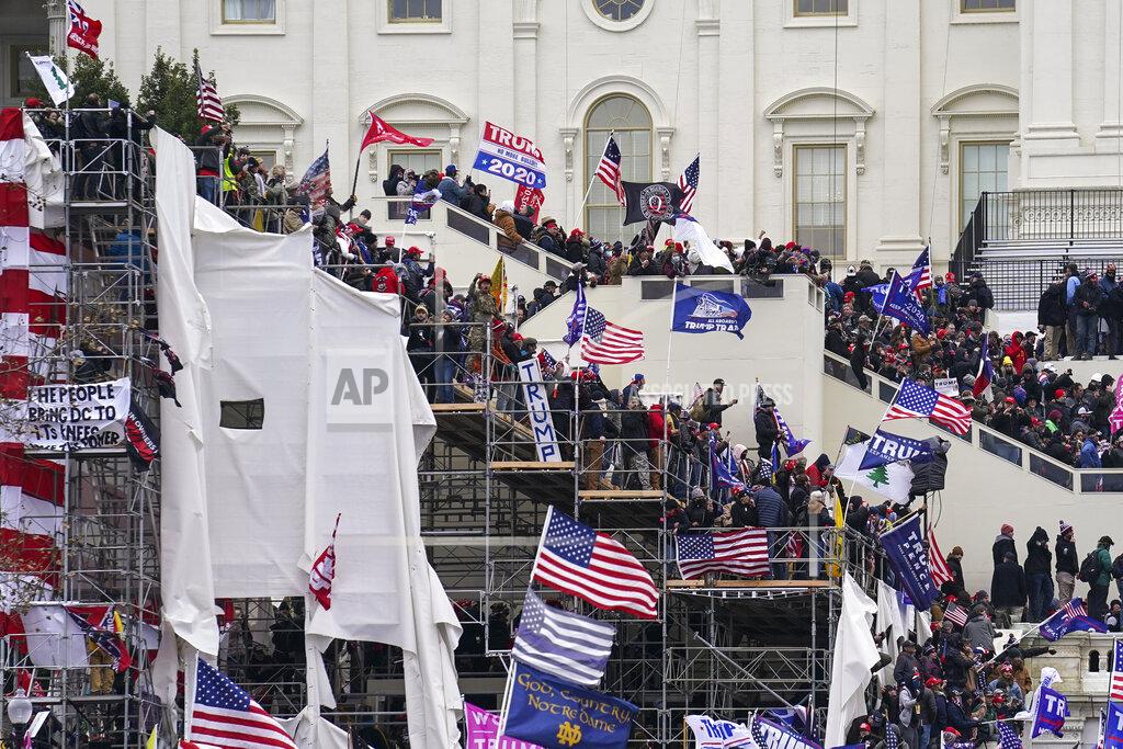 John Minchillo FILE - In this Jan. 6, 2021, file photo rioters loyal to President Donald Trump storm the U.S. Capitol in Washington. Arguments begin Tuesday, Feb. 9, in the impeachment trial of Donald Trump on allegations that he incited the violent mob that stormed the U.S. Capitol on Jan. 6. (AP Photo/John Minchillo, File)