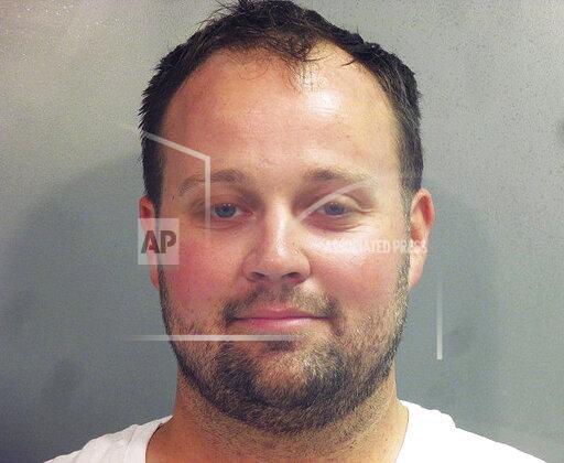 FILE - This undated photo provided by the Washington County (Ark.) Jail shows Joshua Duggar. A federal judge says no phones, laptops or recording devices will be allowed at next week's scheduled trial for former reality TV star Josh Duggar, who is facing child pornography charges. U.S. District Judge Timothy L. Brooks issued the order ahead of the trial, which is set to begin Tuesday in Fayetteville. (Washington County Arkansas Jail via AP, File)