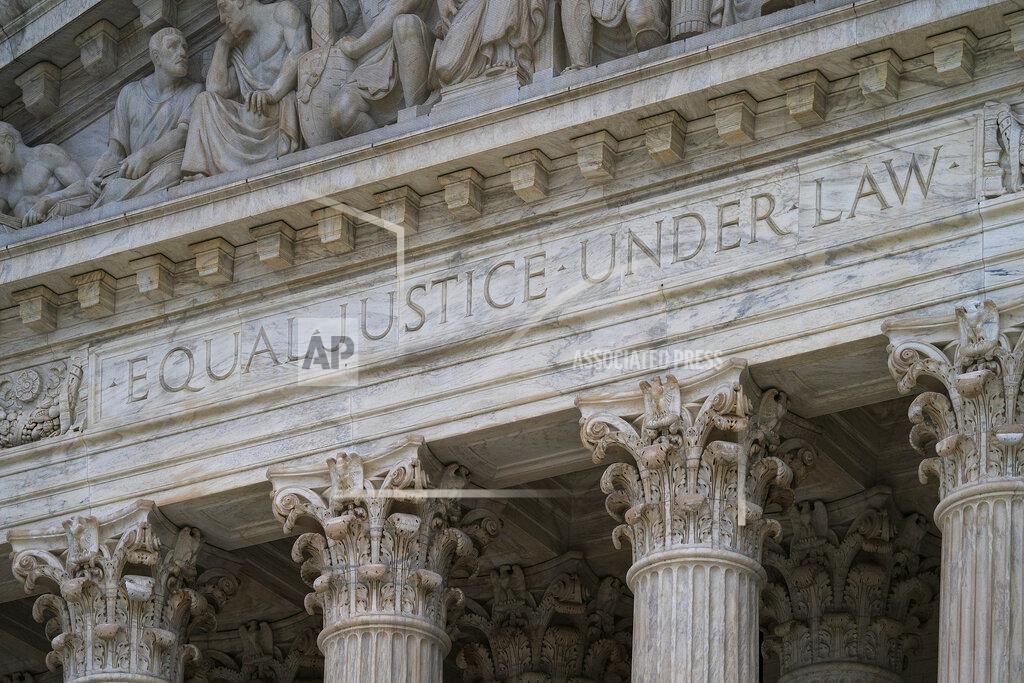 FILE - In this March 20, 2019, file photo, the west facade of the Supreme Court Building bears the motto