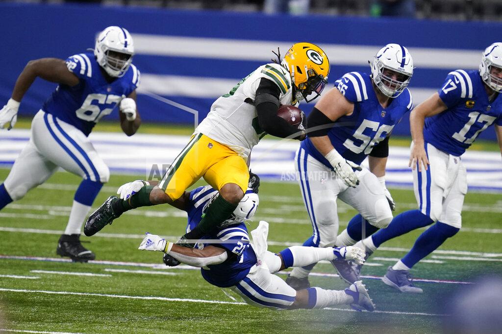 Michael Conroy Green Bay Packers' Christian Kirksey, center top, is tackled by Indianapolis Colts' Nyheim Hines (21) during the first half of an NFL football game, Sunday, Nov. 22, 2020, in Indianapolis. (AP Photo/Michael Conroy)