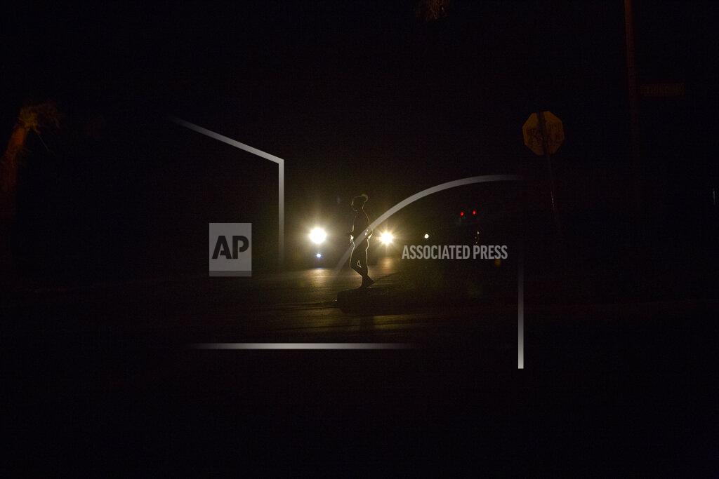 Tsvangirayi Mukwazhi A sex worker walks on a street in Harare, Zimbabwe, Thursday, April, 30, 2020. As the coronavirus spreads in Africa, it increasingly threatens those who earn their living on the streets, including sex workers with HIV. (AP Photo/Tsvangirayi Mukwazhi)