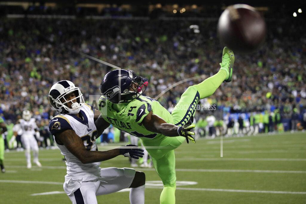 Stephen Brashear Seattle Seahawks wide receiver DK Metcalf, right, goes down next to Los Angeles Rams cornerback Marcus Peters as a pass for a 2-point conversion falls incomplete during the second half of an NFL football game Thursday, Oct. 3, 2019, in Seattle. (AP Photo/Stephen Brashear)