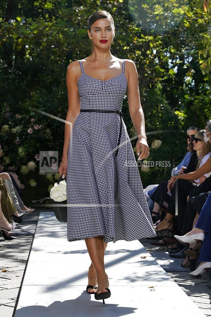 Richard Drew The Michael Kors Spring/Summer 2022 collection is modeled during Fashion Week, in New York, Friday, Sept. 10, 2021. (AP Photo/Richard Drew)