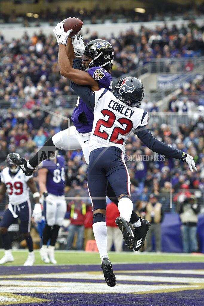 Gail Burton Baltimore Ravens wide receiver Seth Roberts, left, catches a touchdown pass from quarterback Lamar Jackson, not visible, as Houston Texans cornerback Gareon Conley (22) defends during the first half of an NFL football game, Sunday, Nov. 17, 2019, in Baltimore. (AP Photo/Gail Burton)