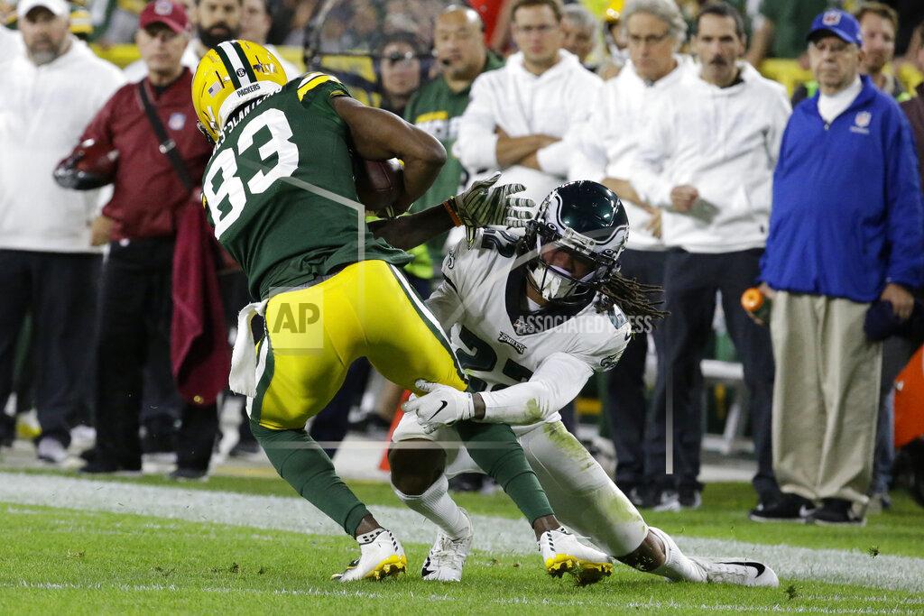 Mike Roemer Green Bay Packers wide receiver Marquez Valdes-Scantling is hit by Philadelphia Eagles cornerback Sidney Jones after a reception during the first half of an NFL football game Thursday, Sept. 26, 2019, in Green Bay, Wis. (AP Photo/Mike Roemer)