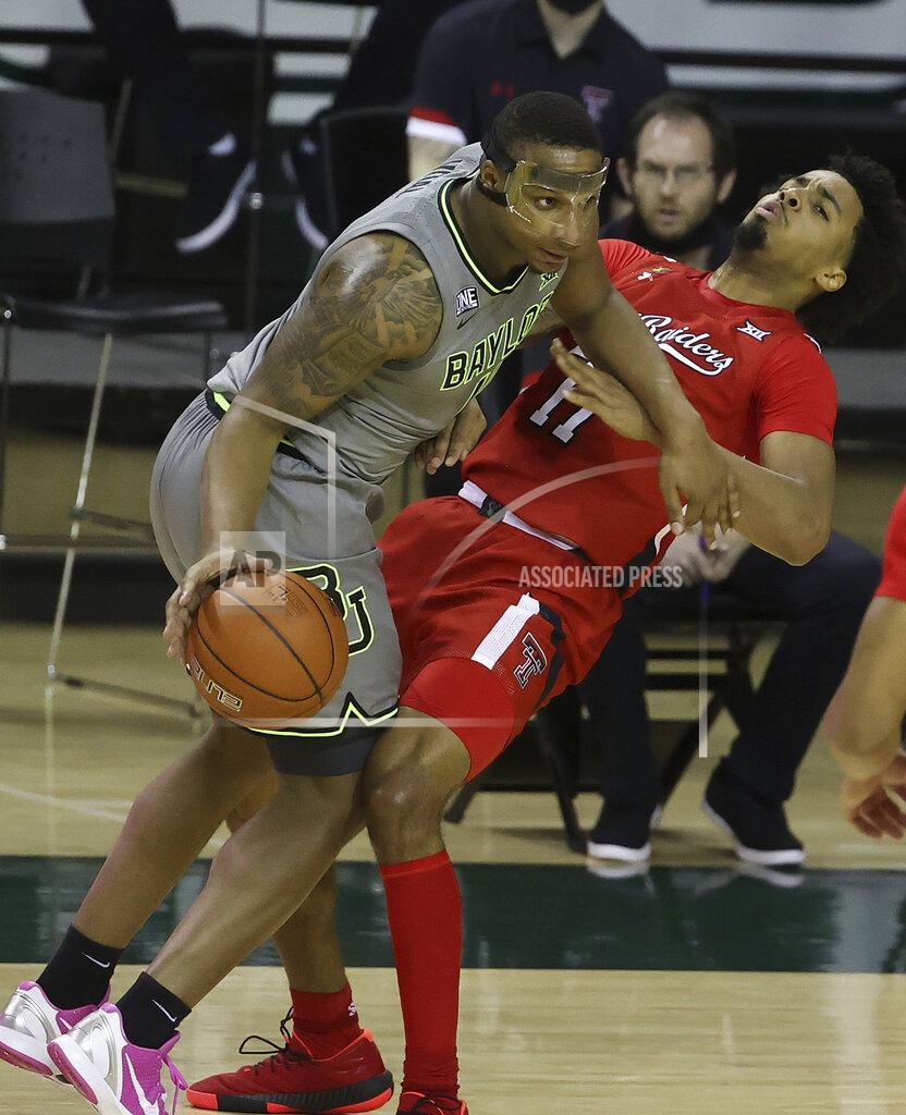 Jerry Larson Baylor guard Mark Vital (11) drives the ball past Texas Tech guard Kyler Edwards (11) in the first half of an NCAA college basketball game Sunday, March 7, 2021, in Waco, Texas. (AP Photo/Jerry Larson)