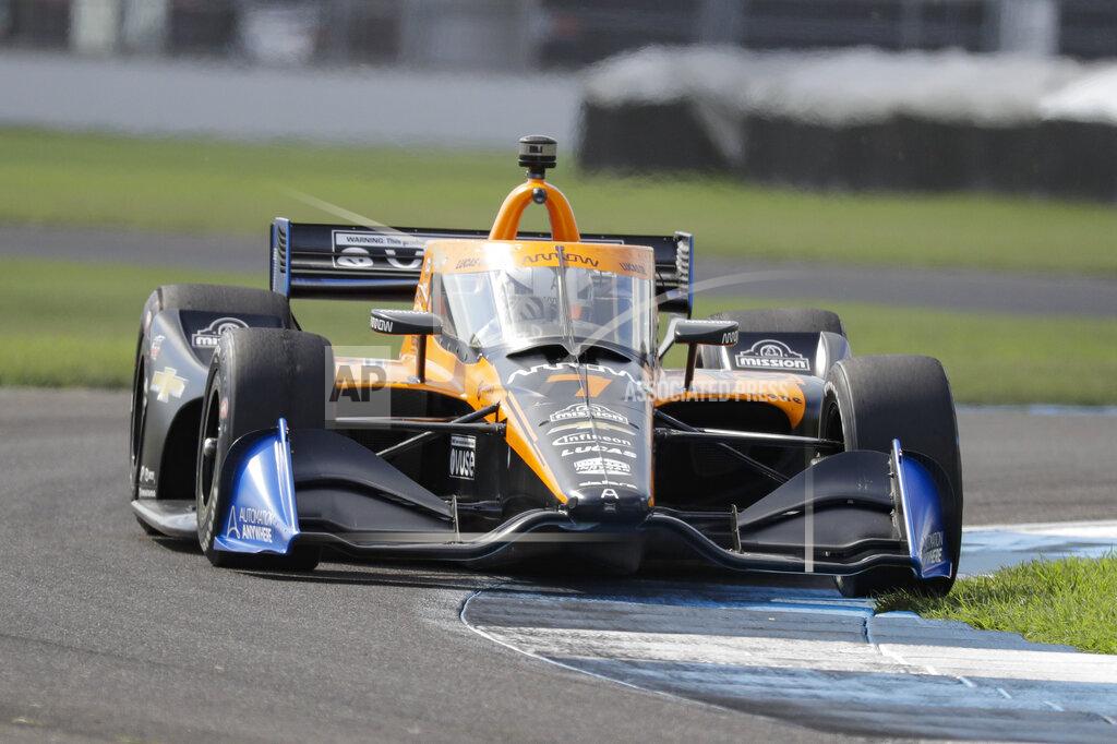 Race driver Oliver Askew drives through a turn during qualifying for the IndyCar auto race at Indianapolis Motor Speedway in Indianapolis, Friday, July 3, 2020. (AP Photo/Darron Cummings)