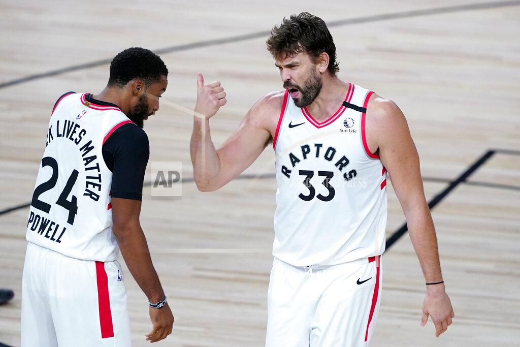Ashley Landis Toronto Raptors' Norman Powell (24) and Marc Gasol (33) talk during the first half of an NBA basketball game against the Boston Celtics Friday, Aug. 7, 2020 in Lake Buena Vista, Fla. (AP Photo/Ashley Landis, Pool)