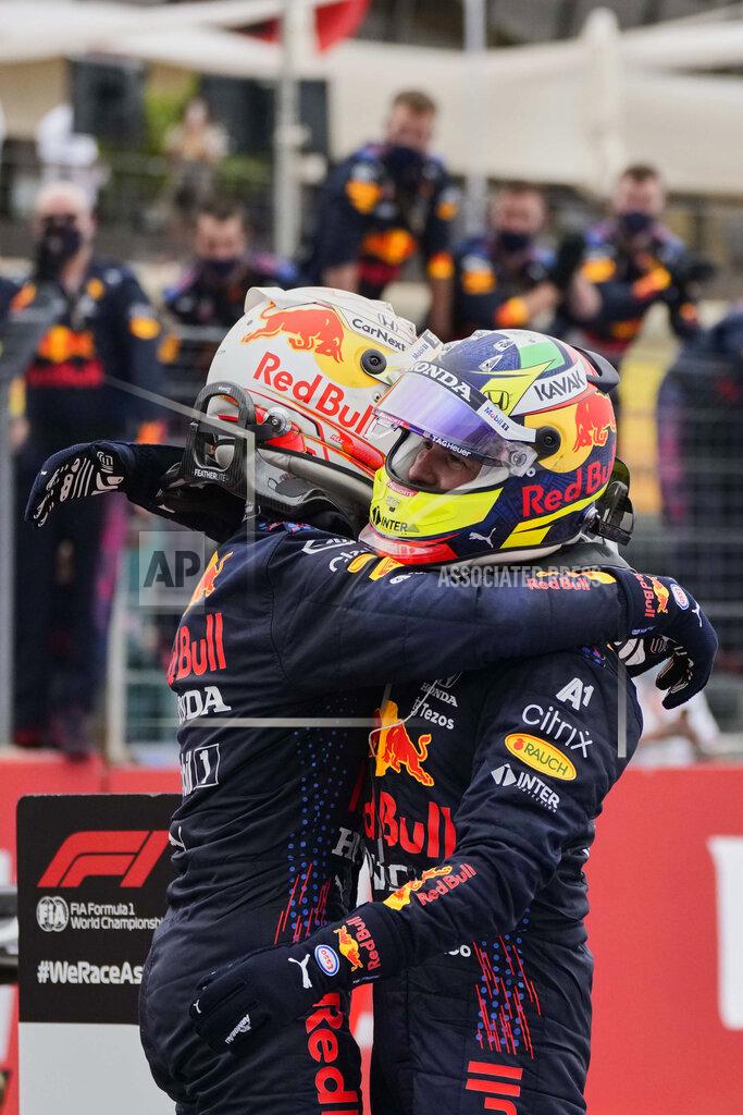 Francois Mori Red Bull driver Max Verstappen of the Netherlands, left, reacts after winning the French Formula One Grand Prix with third place Red Bull driver Sergio Perez of Mexico at the Paul Ricard racetrack in Le Castellet, southern France, Sunday, June 20, 2021. (AP Photo/Francois Mori)
