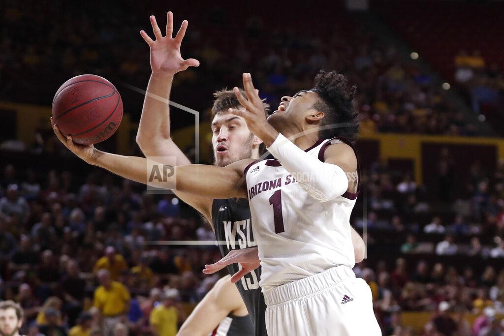 Matt York Arizona State guard Remy Martin shoots under Washington State center Volodymyr Markovetskyy, left, during the second half of an NCAA college basketball game Saturday, March 7, 2020, in Tempe, Ariz. (AP Photo/Matt York)