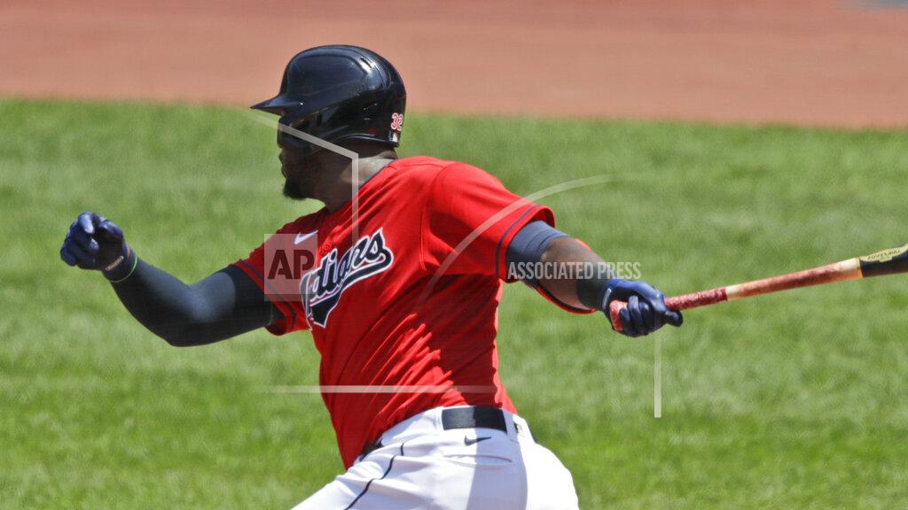 Tony Dejak Cleveland Indians' Franmil Reyes hits an RBI-single in the first inning in a baseball game against the Kansas City Royals, Sunday, July 26, 2020, in Cleveland. (AP Photo/Tony Dejak)