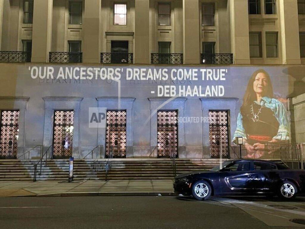 Leah Salgado This photo provided by Leah Salgado shows the image of New Mexico U.S. Rep. Deb Haaland projected on the side of the U.S. Department of the Interior building in Washington, D.C., on Monday, Feb. 22, 2021. Native Americans will be closely watching a confirmation hearing Tuesday, Feb. 23, 2021, for Haaland, who has been nominated to lead the Interior Department. If confirmed, she would be the first Native American to lead the agency that has broad oversight of tribal affairs and energy development. (Leah Salgado via AP)