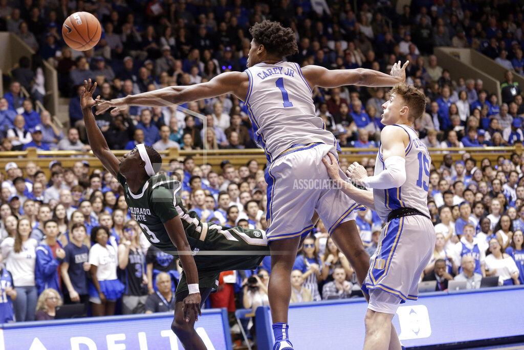 Gerry Broome Colorado State guard Kendle Moore (3) drives to the basket while Duke center Vernon Carey Jr. (1) and guard Alex O'Connell (15) defend during the first half of an NCAA college basketball game in Durham, N.C., Friday, Nov. 8, 2019. (AP Photo/Gerry Broome)