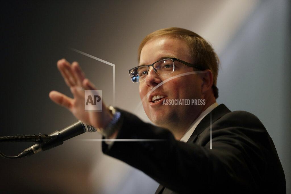 Eliah Drinkwitz gestures after being introduced as the new NCAA college football head coach at the University of Missouri, Tuesday, Dec. 10, 2019, in Columbia, Mo. Drinkwitz becomes the 33rd head football coach at Missouri after coaching the 2019 season at Appalachian State. (AP Photo/Jeff Roberson)