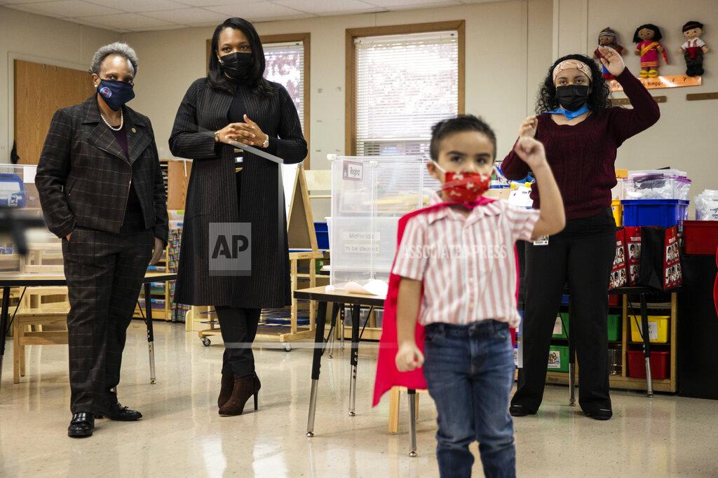 Ashlee Rezin Garcia Mayor Lori Lightfoot, left, and Chicago Public Schools CEO Janice Jackson, second from left, visit a preschool classroom at Dawes Elementary School in Chicago, Monday, Jan. 11, 2021. Monday was the first day of optional in-person learning for preschoolers and some special education students in Chicago Public Schools after going remote last March due to the coronavirus pandemic. (Ashlee Rezin Garcia/Chicago Sun-Times via AP, Pool)