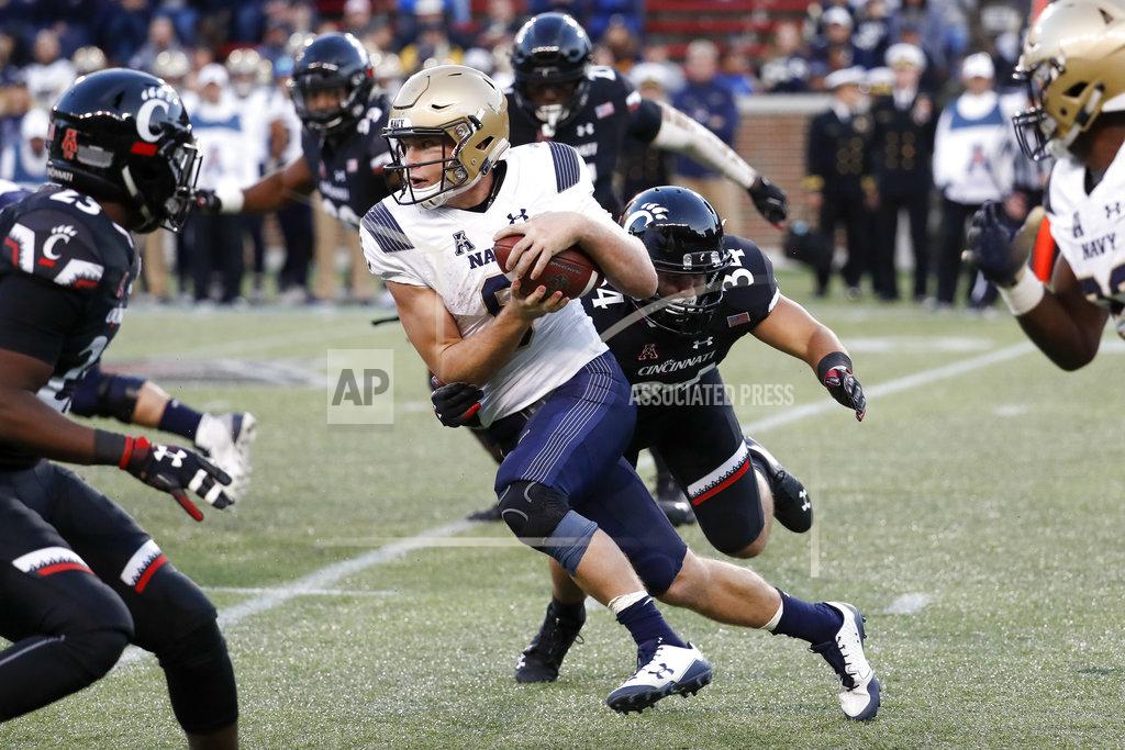 John Minchillo Navy wide receiver Zach Abey, center left, is tackled by Cincinnati linebacker Kyle Bolden (34) in the second half of an NCAA college football game, Saturday, Nov. 3, 2018, in Cincinnati. (AP Photo/John Minchillo)