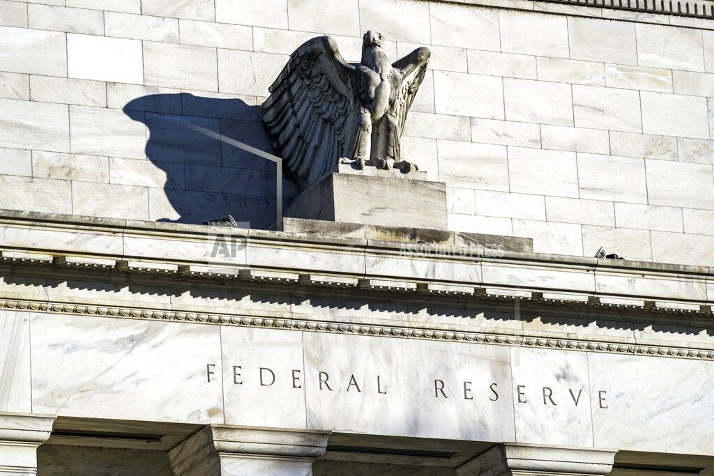 FILE - This Nov. 16, 2020, file photo, shows the Federal Reserve in Washington. The Federal Reserve said Thursday, March 25, 2021, that as of June 30 it will end for most banks the temporary limits it had imposed on their ability to make dividend payments and buy back their own stock. (AP Photo/J. Scott Applewhite)