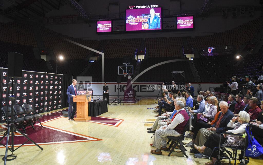 Michael Shroyer Director of Virginia Tech athletics Whit Babcock, introduces Mike Young as the next men's basketball coach, April 8, 2019. (Michael Shroyer/The Roanoke Times via AP)