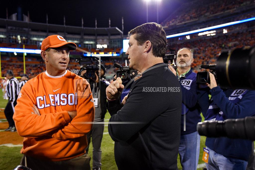 Richard Shiro Clemson head coach Dabo Swinney, left, speaks with South Carolina head coach Will Muschamp before the start of an NCAA college football game Saturday, Nov. 24, 2018, in Clemson, S.C. (AP Photo/Richard Shiro)