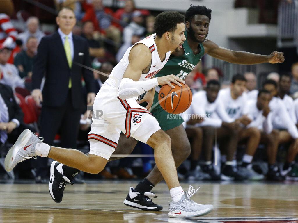 Jay Laprete Ohio State's Duane Washington, left, brings the ball up court against Stetson's Kenny Aninye during the first half of an NCAA college basketball game Monday, Nov. 18, 2019, in Columbus, Ohio. (AP Photo/Jay LaPrete)