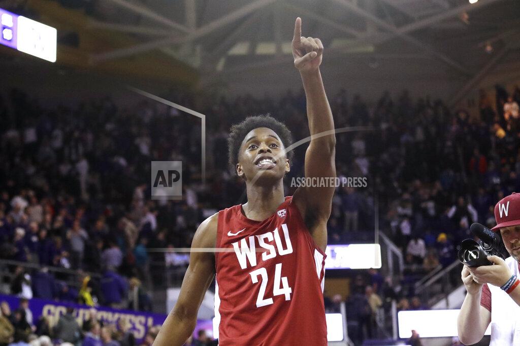 Elaine Thompson Washington State's Noah Williams points toward the stands after Washington State defeated Washington 78-74 in an NCAA college basketball game Friday, Feb. 28, 2020, in Seattle. (AP Photo/Elaine Thompson)