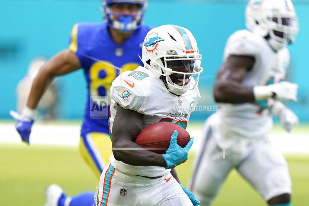 Wilfredo Lee Miami Dolphins wide receiver Jakeem Grant (19) runs for touchdown during the first half of an NFL football game against the Los Angeles Rams, Sunday, Nov. 1, 2020, in Miami Gardens, Fla. (AP Photo/Wilfredo Lee)