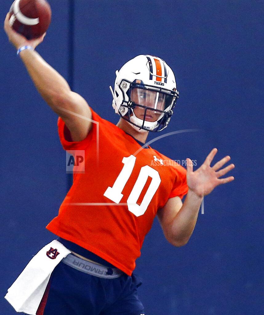 Butch Dill FILE - In this Aug. 2, 2019, file photo, Auburn quarterback Bo Nix throws a pass during NCAA college football practice in Auburn, Ala. Freshman quarterback Bo Nix makes his college debut for No. 16 Auburn by matching up with No. 11 Oregon quarterback and potential first-round draft pick Justin Herbert in Arlington, Texas on Saturday, Aug. 31. (AP Photo/Butch Dill, File)