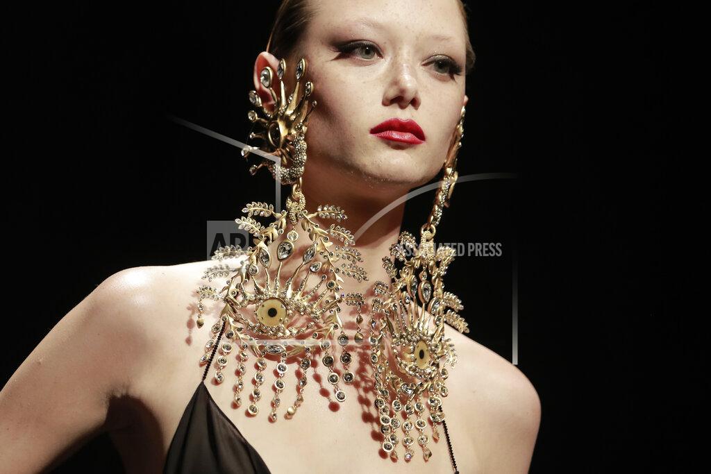 Lewis Joly A model wears a creation for Schiaparelli's Haute Couture Fall/Winter 2022-2023 fashion collection, Monday, July 4, 2022 in Paris. (AP Photo/Lewis Joly)