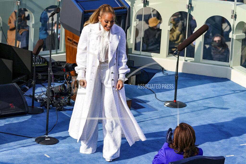 Tasos Katopodis Singer Jennifer Lopez greets Vice President-elect Kamala Harris during President-elect Joe Biden’s inauguration, Wednesday, Jan. 20, 2021, at the U.S. Capitol in Washington. (Tasos Katopodis/Pool Photo via AP)