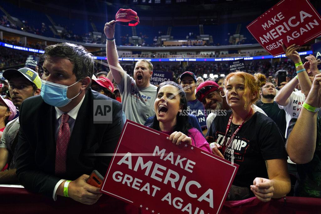 Evan Vucci President Donald Trump supporters cheer as they attend a campaign rally at the BOK Center, Saturday, June 20, 2020, in Tulsa, Okla. (AP Photo/Evan Vucci)