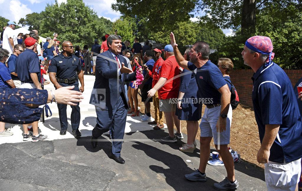 Thomas Graning Mississippi head coach Matt Luke greets fans during the Walk of Champions before an NCAA college football game between Louisiana Monroe and Mississippi in Oxford, Miss., Saturday, Oct. 6, 2018. (AP Photo/Thomas Graning)