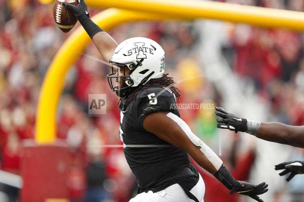 Charlie Neibergall Iowa State defensive end Eyioma Uwazurike celebrates as he returns a fumble for a touchdown during the first half of an NCAA college football game against TCU, Saturday, Oct. 5, 2019, in Ames, Iowa. (AP Photo/Charlie Neibergall)