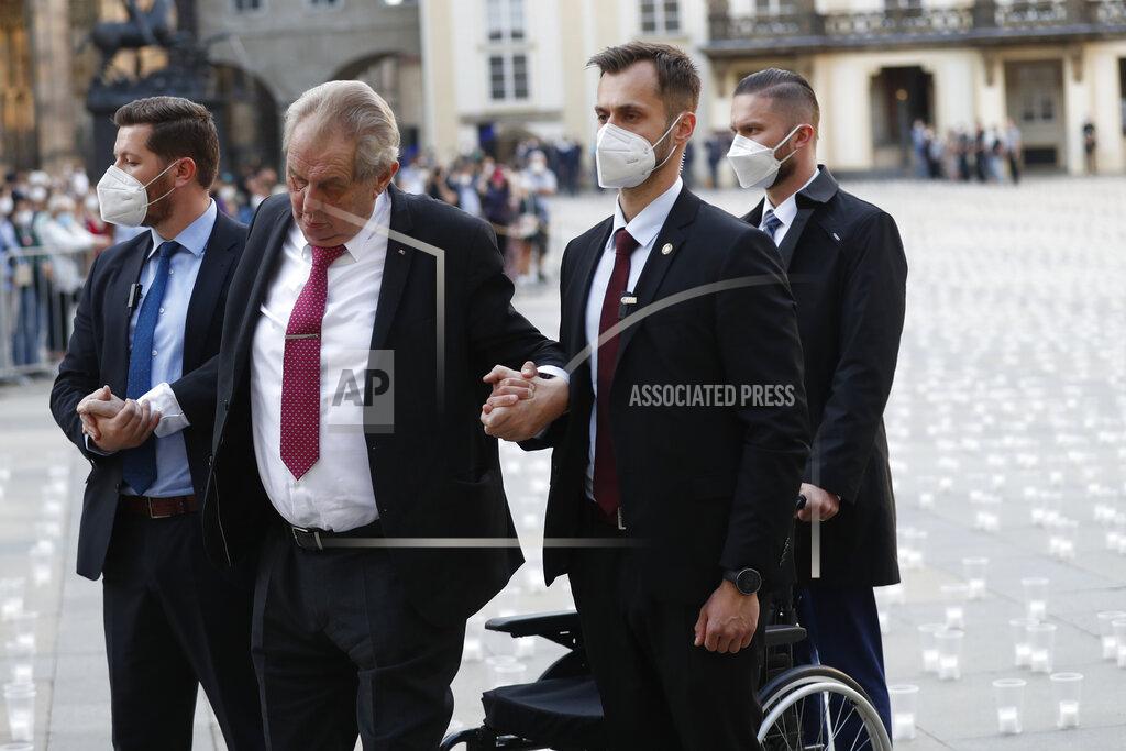 Petr David Josek Czech Republic's President Milos Zeman is helped as he arrives to light a candle to commemorate victims of the COVD-19 pandemic at the Prague Castle in Prague, Czech Republic, Monday, May 10, 2021. The Czech Republic is massively relaxing its coronavirus restrictions as the hard-hit nation pays respect to nearly 30,000 dead. (AP Photo/Petr David Josek)