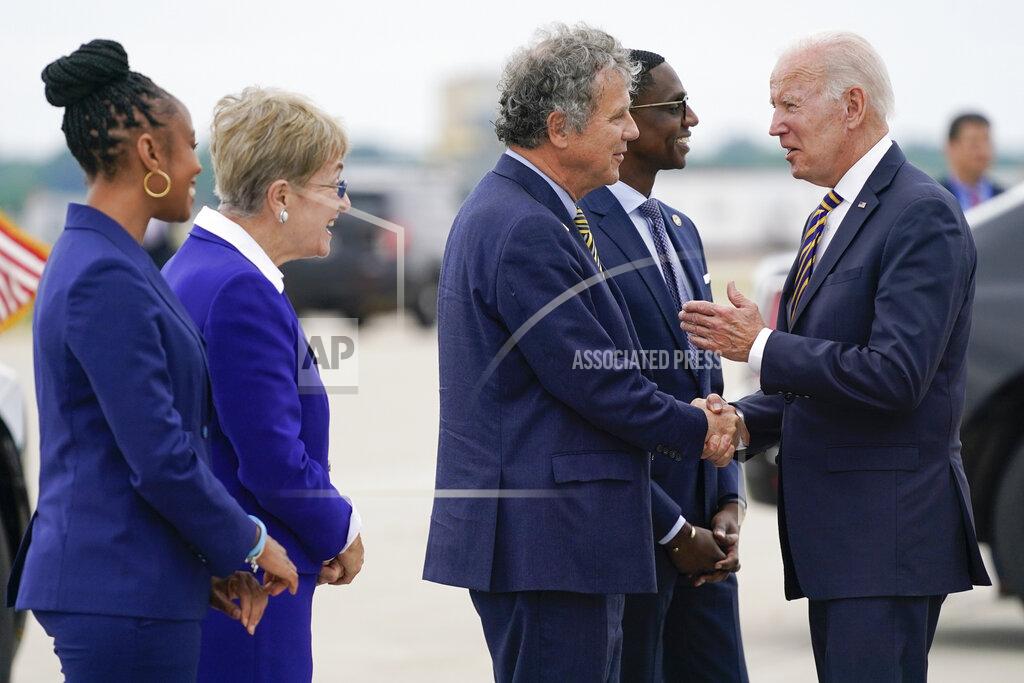 Evan Vucci President Joe Biden shakes hands with Sen. Sherrod Brown, D-Ohio, as he arrives at Cleveland Hopkins International Airport, Wednesday, July 6, 2022, in Cleveland. From left, Rep. Shontel Brown, D-Ohio, Rep. Marcy Kaptur, D-Ohio, Brown, Cleveland Mayor Justin Bibb and Biden. (AP Photo/Evan Vucci)