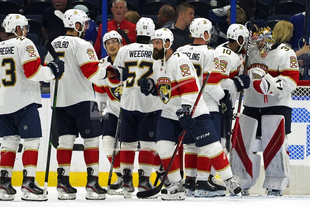 Chris O'MEara Florida Panthers players celebrate with goaltender Spencer Knight (30) after the team defeated the Tampa Bay Lightning during an NHL hockey game Tuesday, Oct. 19, 2021, in Tampa, Fla. (AP Photo/Chris O'Meara)