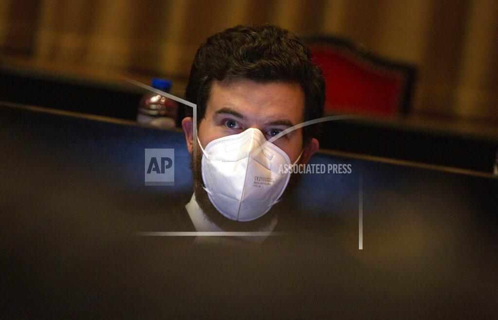 Virginia Mayo Lawyer for the European Commission Charles Edouard Lambert waits for the start of a hearing, European Commission vs AstraZeneca, at the main courthouse in Brussels, Wednesday, May 26, 2021. While the EU insists AstraZeneca has breached its contractual obligations, the company says it has fully complied with the agreement, arguing that vaccines are difficult to manufacture and it made its best effort to deliver on time. the European Union's executive branch will try to persuade a Brussels court Wednesday that the case is urgent enough to justify ordering the company to make an immediate delivery of the missing shots. (AP Photo/Virginia Mayo)