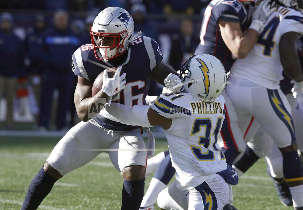 Charles Krupa Los Angeles Chargers defensive back Adrian Phillips (31) tackles New England Patriots running back Sony Michel (26) during the first half of an NFL divisional playoff football game, Sunday, Jan. 13, 2019, in Foxborough, Mass. (AP Photo/Charles Krupa)