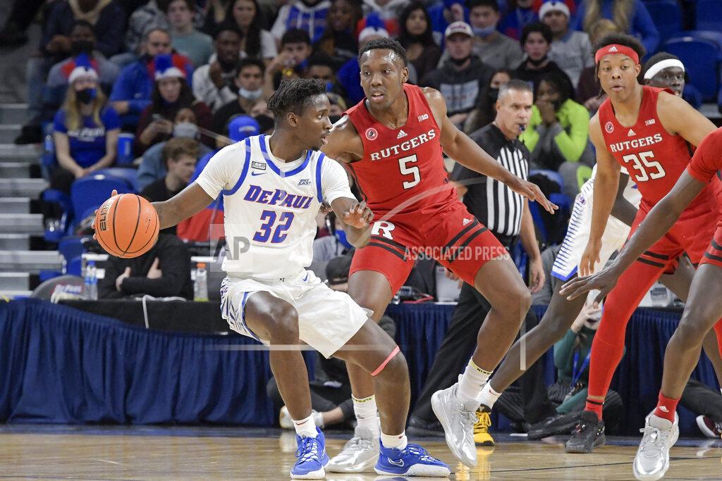 Mark Black DePaul's David Jones (32) works for a good shooting position against Rutgers' Aundre Hyatt (5) during the first half of an NCAA college basketball game Thursday, Nov. 18, 2021, in Chicago. (AP Photo/Mark Black)