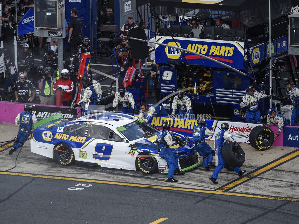 Mike Mccarn Chase Elliott (9) makes a pit stop during a NASCAR Cup Series auto race at Charlotte Motor Speedway, Sunday, Sept. 29, 2019, in Concord, N.C. (AP Photo/Mike McCarn)